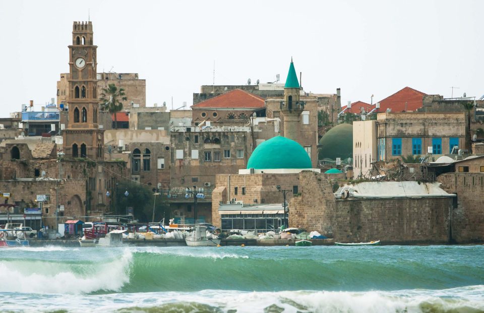 A wave beaking in akko city, image by surfing photographer uri magnus.