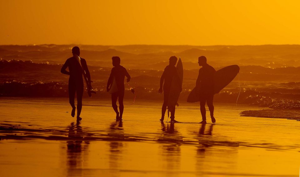 Surfer on the beach, image by uri magnus